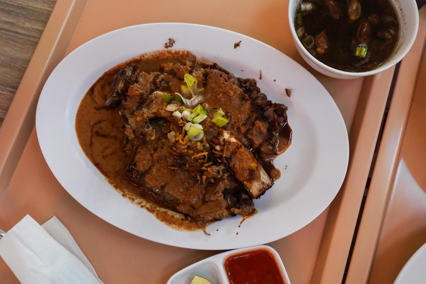 Sop Konro Soup, konro bakar grilled the delicious one, Beef Soup is usually made from ribs or oxtail, a typical Indonesian soto dish originating from Makassar photo