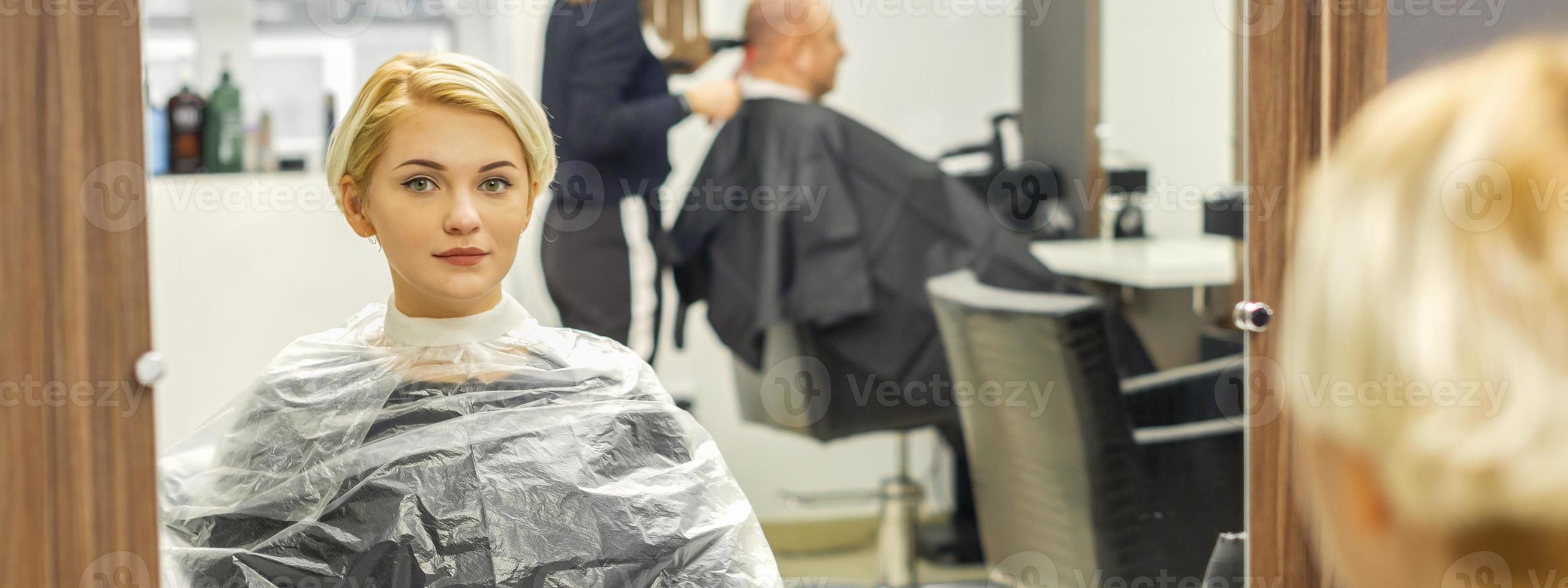 Female client waiting for hairdresser photo