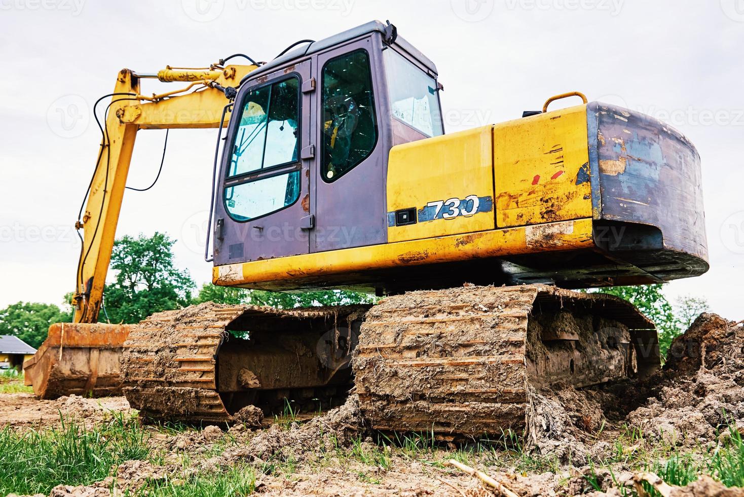 Excavator on construction site photo