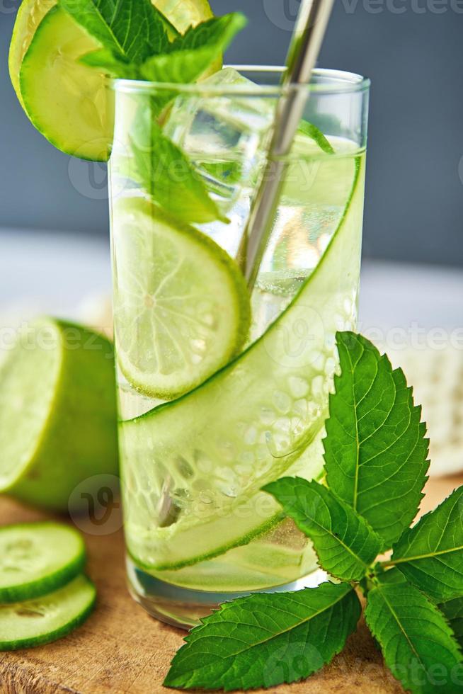 Detox refreshment drink. Lemonade with lime and cucumber photo