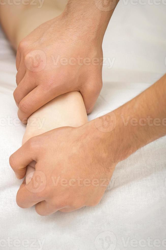 Foot massage in two hands photo