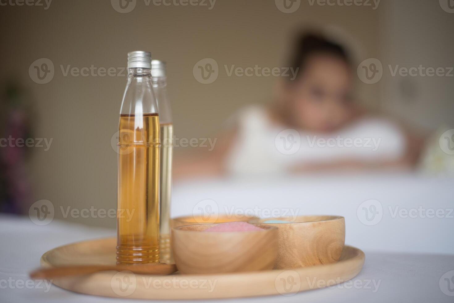 hand holding bottle of aroma essential oil photo