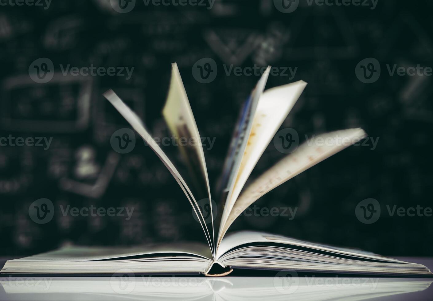 open book on table photo