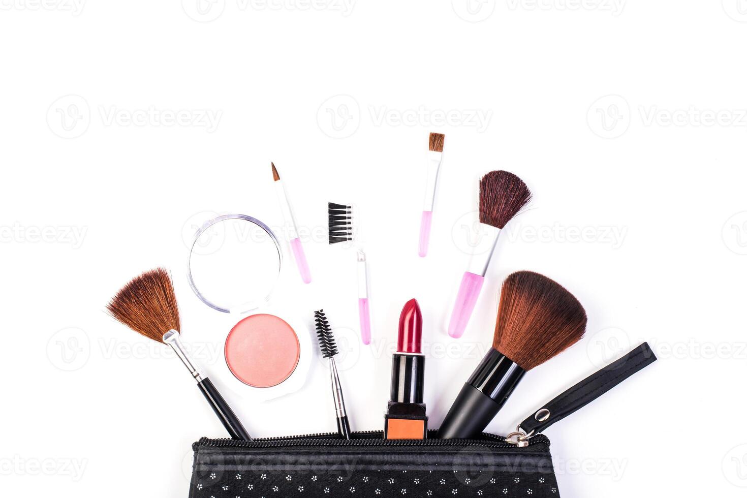 beauty bag with different cosmetics on table photo