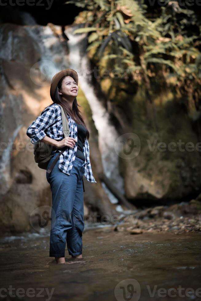 woman on a waterfall photo