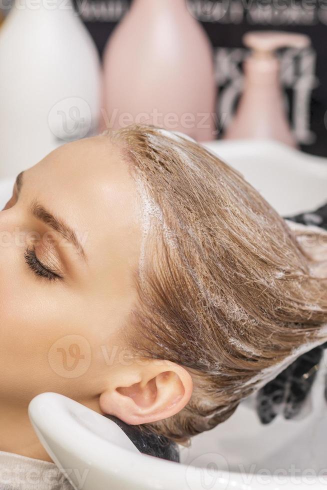 Woman receiving wash her hair photo