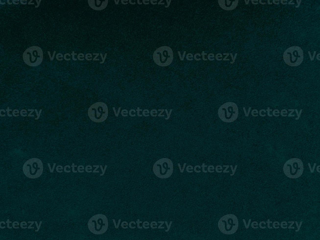 Dark green old velvet fabric texture used as background. Empty green fabric background of soft and smooth textile material. There is space for text. photo