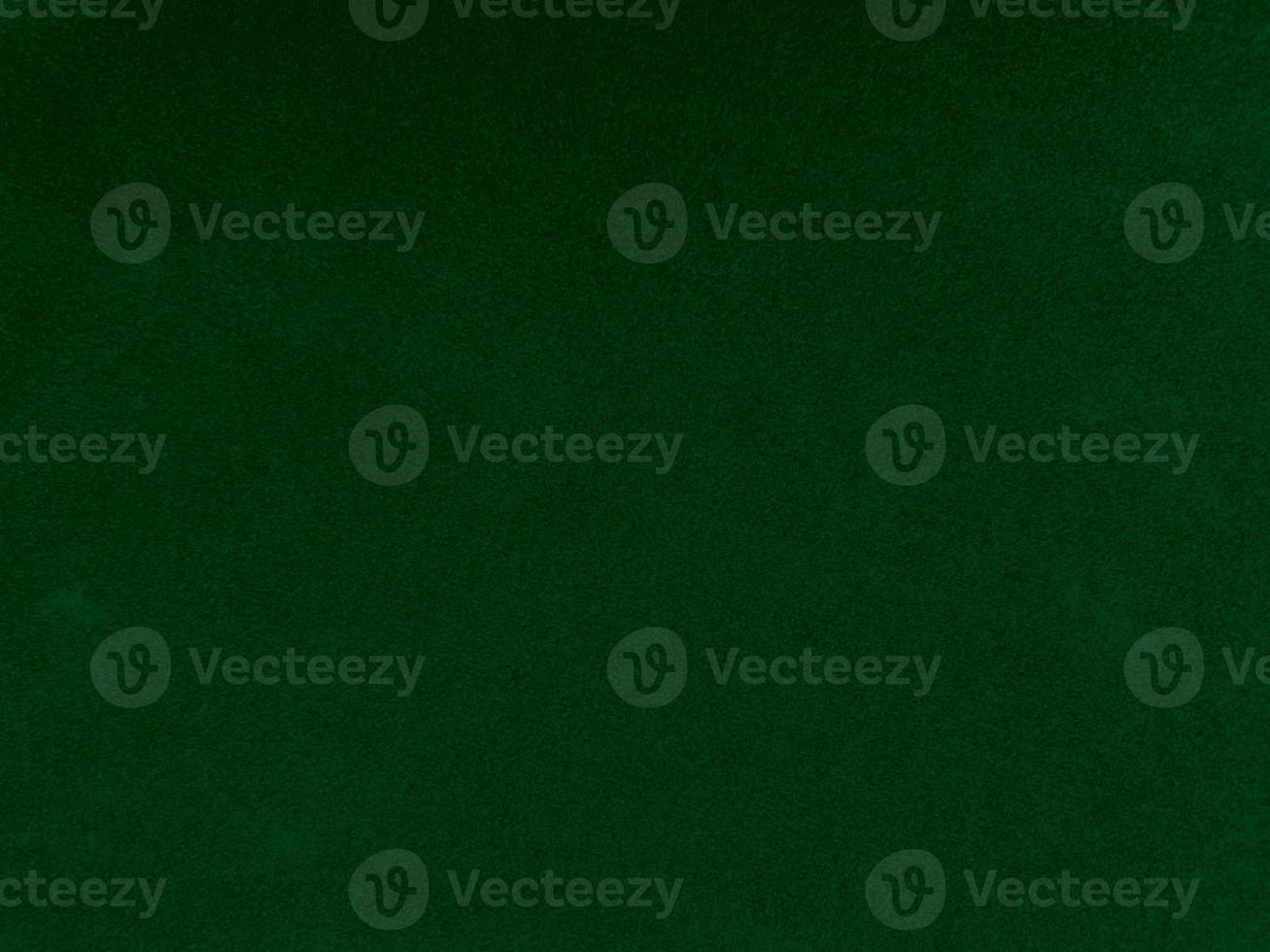 Dark green old velvet fabric texture used as background. Empty green fabric background of soft and smooth textile material. There is space for text. photo