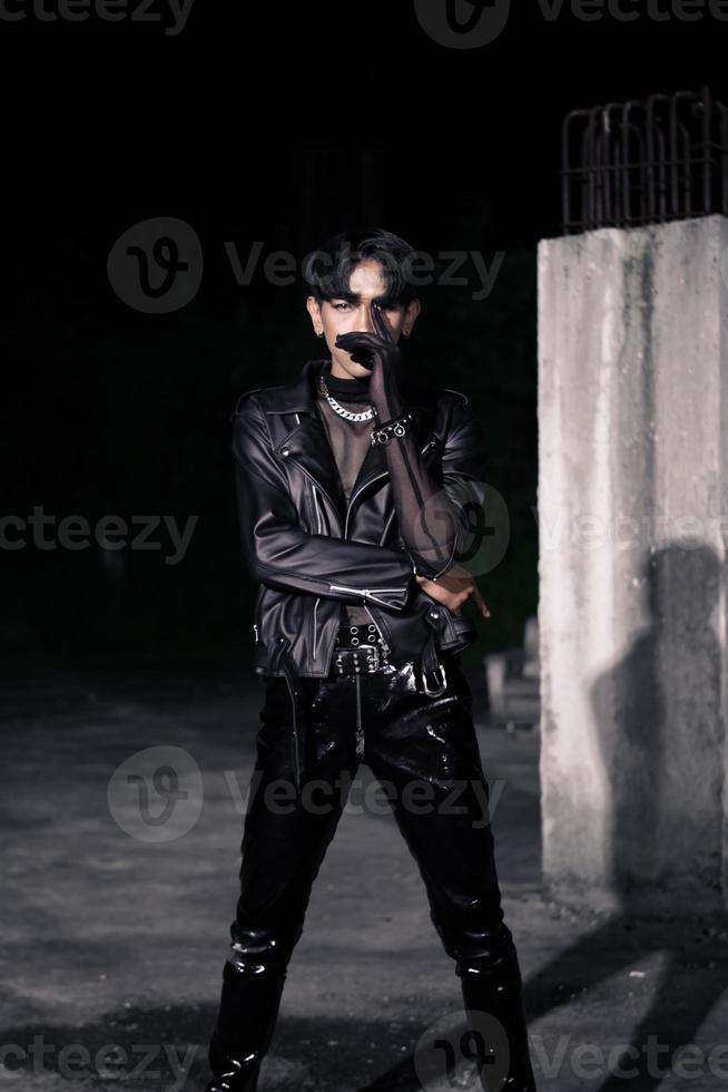 an asian man in a black leather jacket posing like a motorcycle gang photo