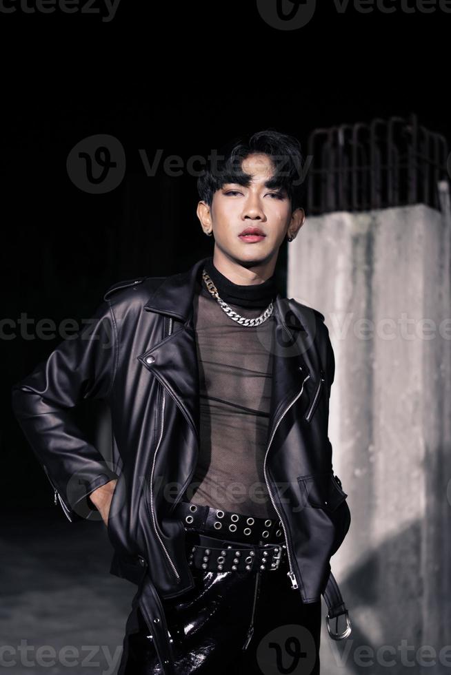 an asian man in a black leather jacket posing like a motorcycle gang photo