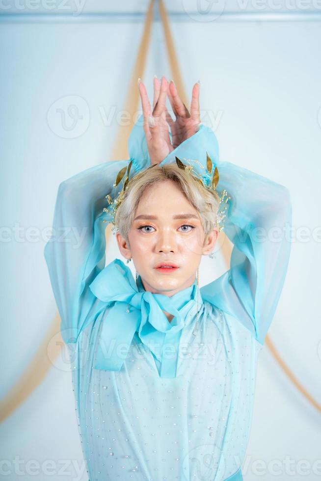 an Asian woman with glowing makeup posing very elegantly photo