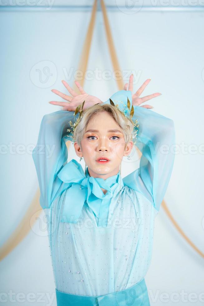 an Asian woman with glowing makeup posing very elegantly photo