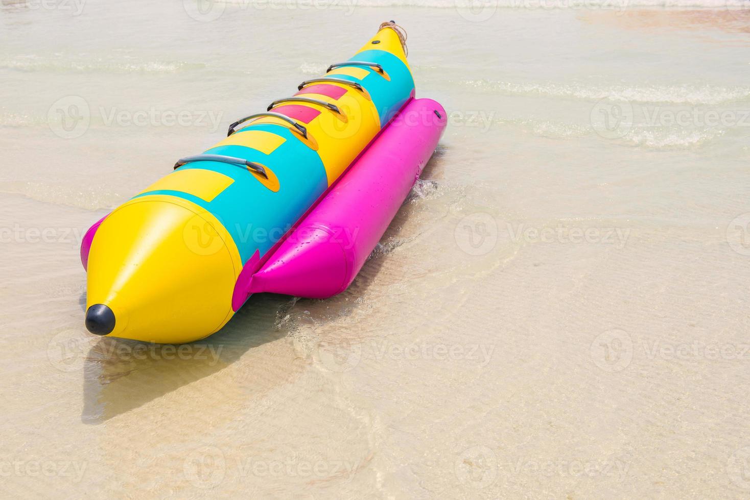 Banana boat on beach photo