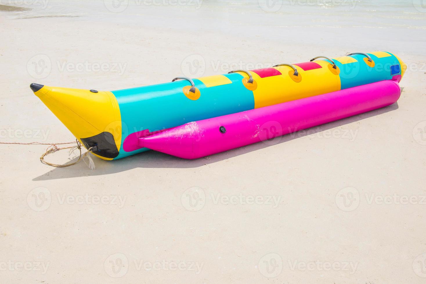 Banana boat on beach photo