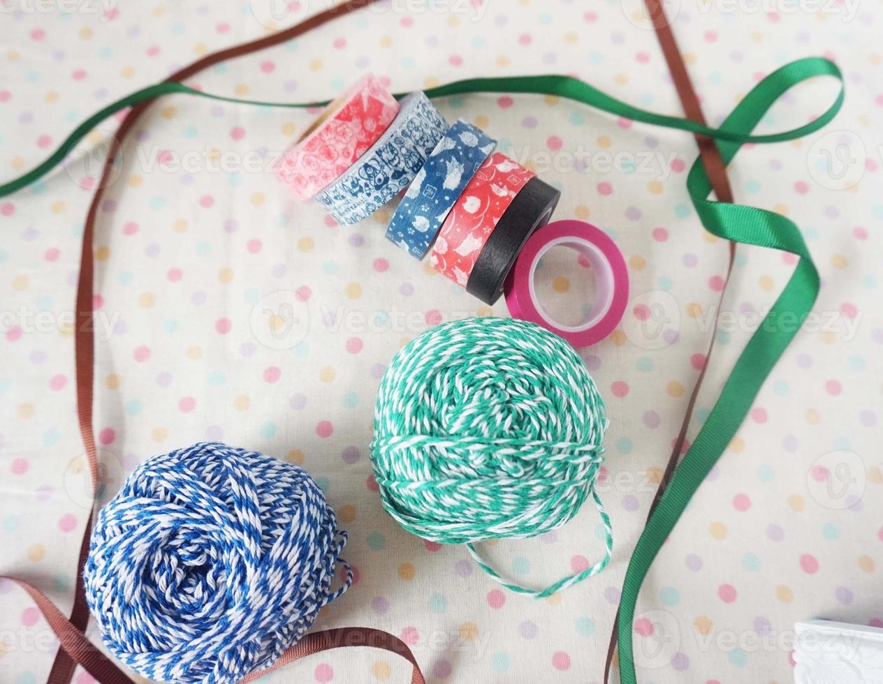 Colorful ribbons of different colors and sizes in a shop window photo
