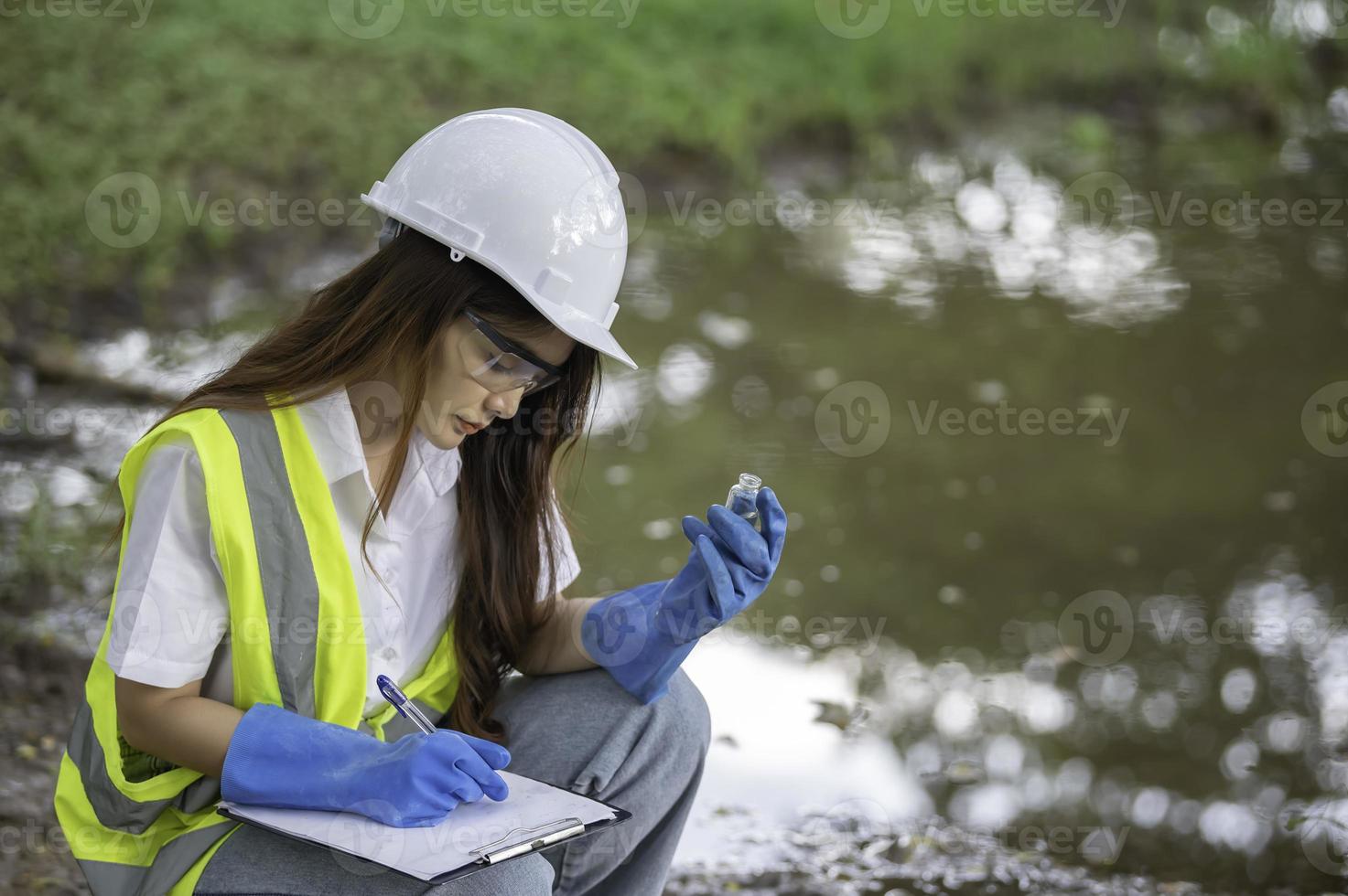 Environmental engineers inspect water quality,Bring water to the lab for testing,Check the mineral content in water and soil,Check for contaminants in water sources. photo