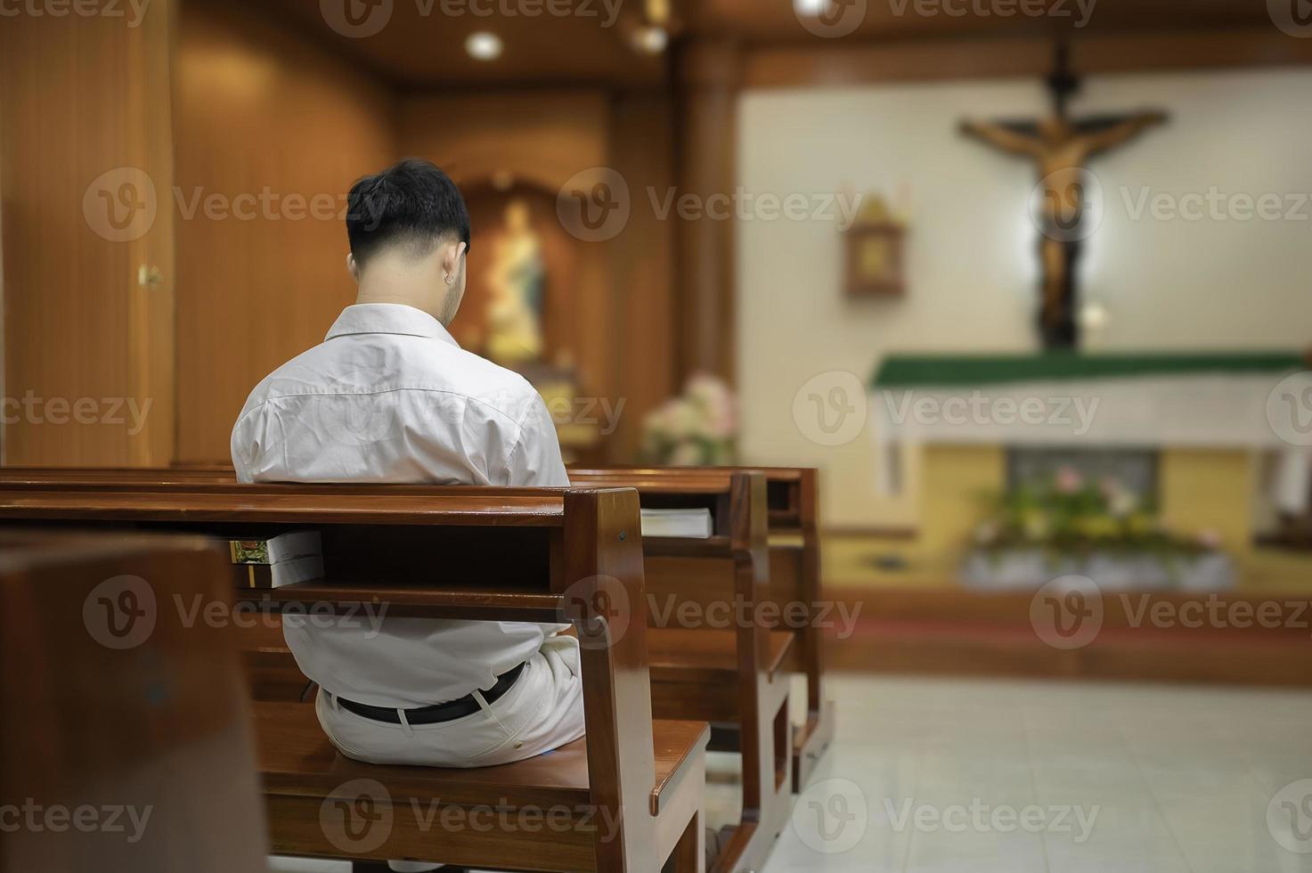 Christian man asking for blessings from God,Asian man praying to Jesus Christ photo