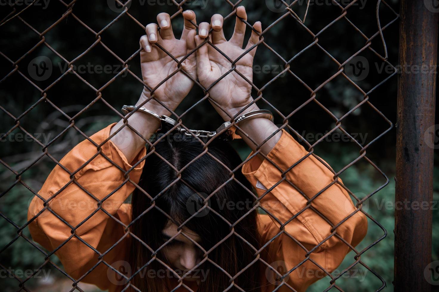 Prisoner in orange robe concept,Portrait of asian woman in Prison uniforms on white background, photo