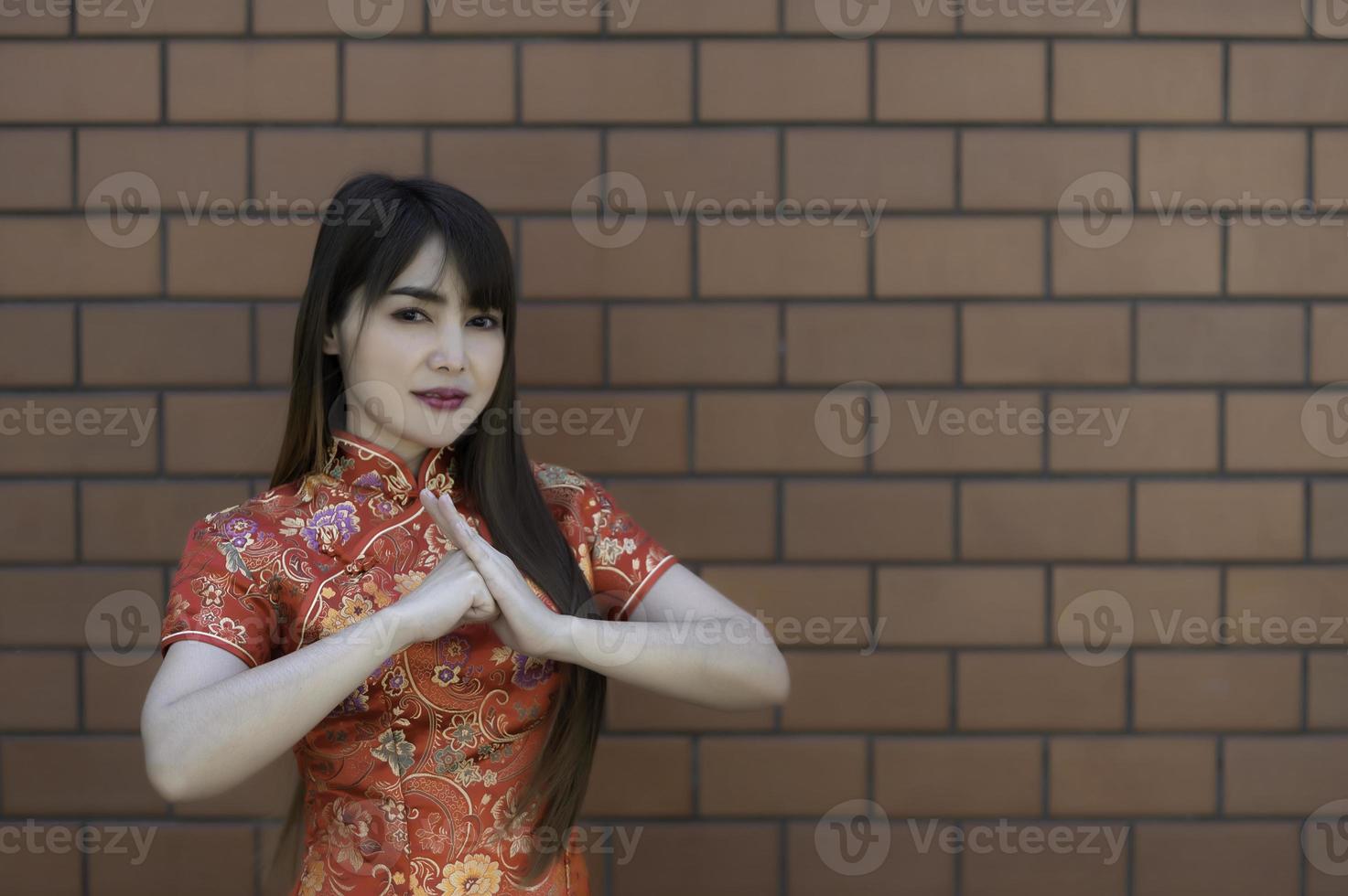 Portrait beautiful asian woman in Cheongsam dress,Thailand people,Happy Chinese new year concept,Happy asian lady in chinese traditional dress photo