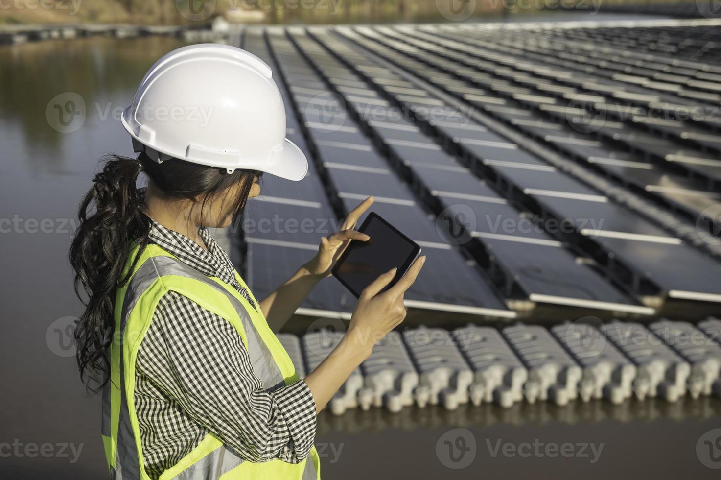 Asian engineer working at Floating solar farm,Renewable energy 