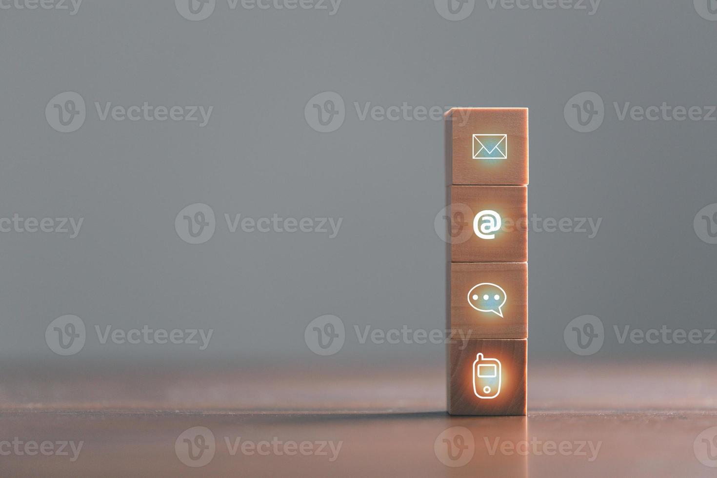 Website page contact us or e-mail marketing concept, Customer support hotline Contact us people connection. cube wood with email, call phone, address, Chat message icons. banner with copy space. photo