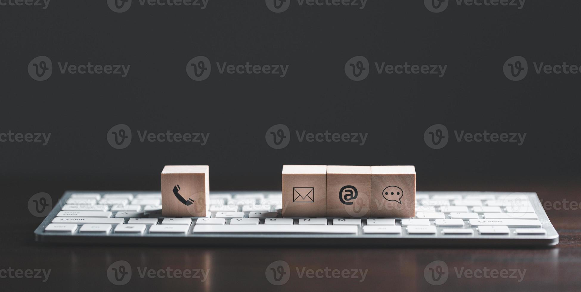 Website page contact us or e-mail marketing concept, Customer support hotline Contact us people connection. cube wood with email, call phone, address, Chat message icons. banner with copy space. photo