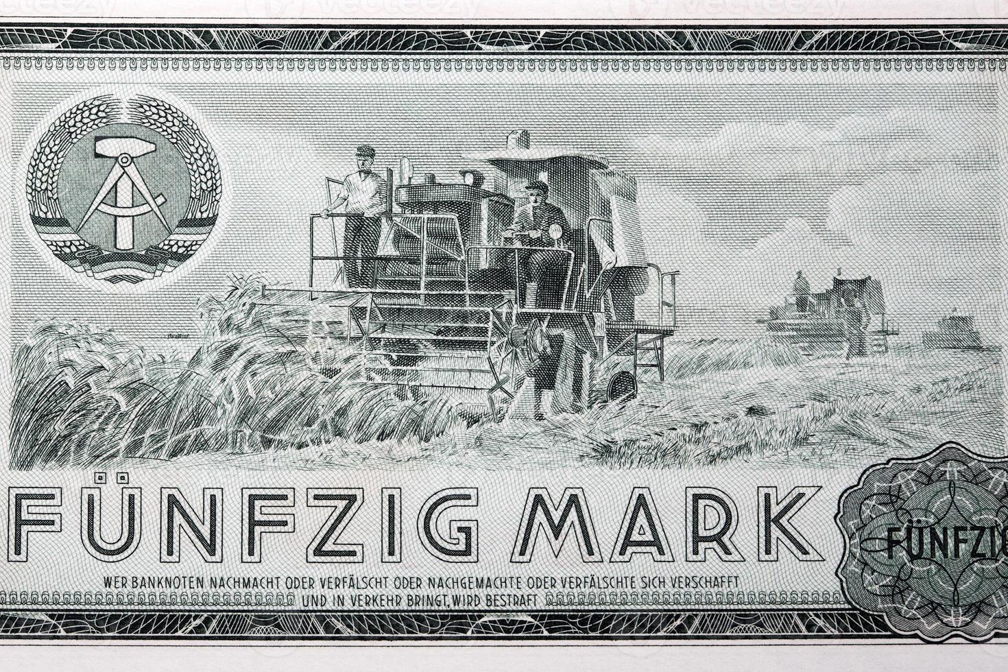 Wheat harvesting from old East German money photo