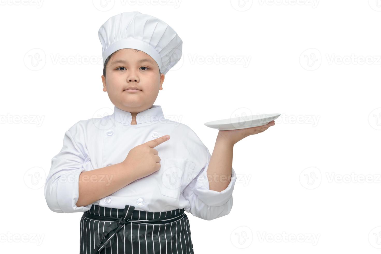 chef holding plate and pointing on it. photo