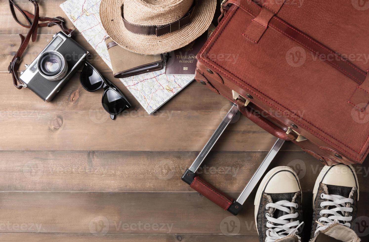 prepare accessories and travel items on wooden board photo