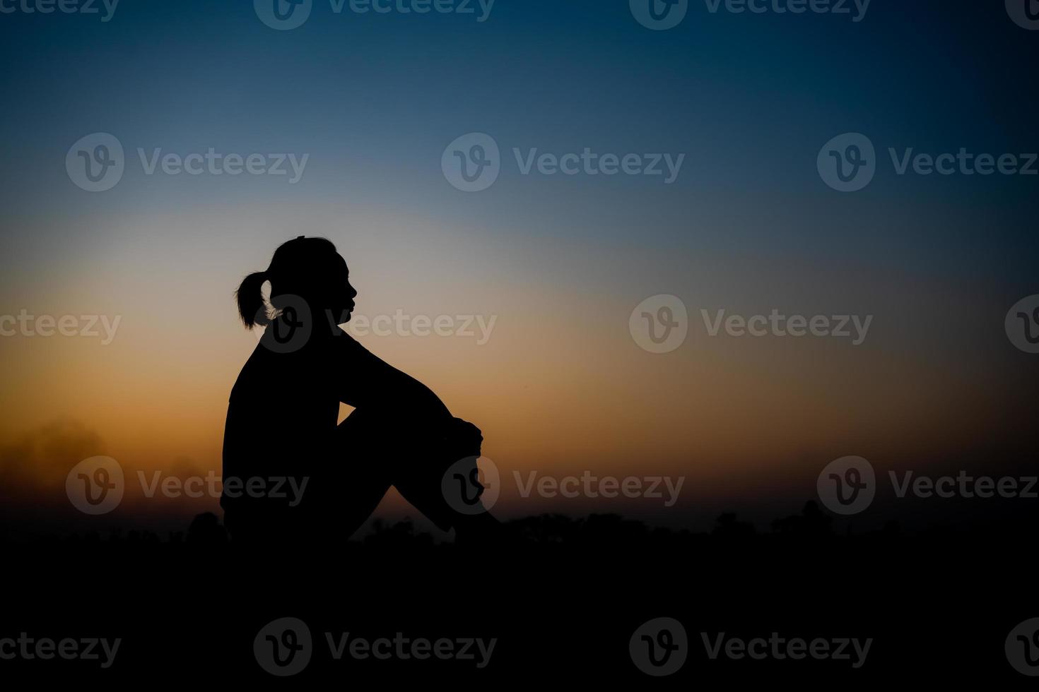 sad woman sitting silhouette