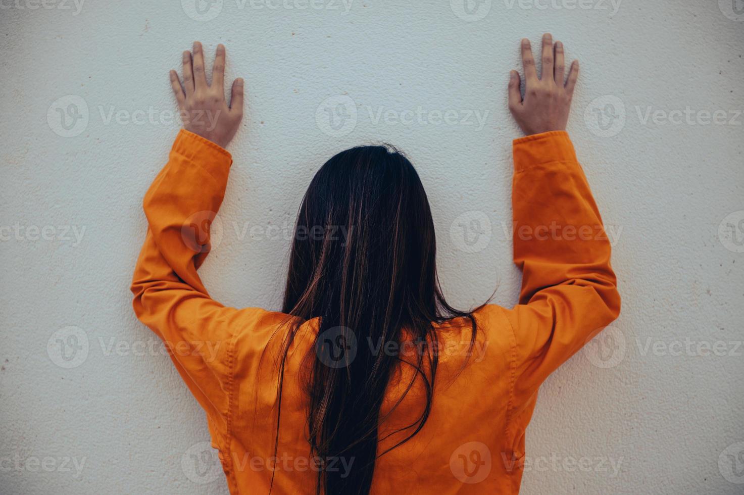 Prisoner in orange robe concept,Portrait of asian woman in Prison uniforms on white background, photo