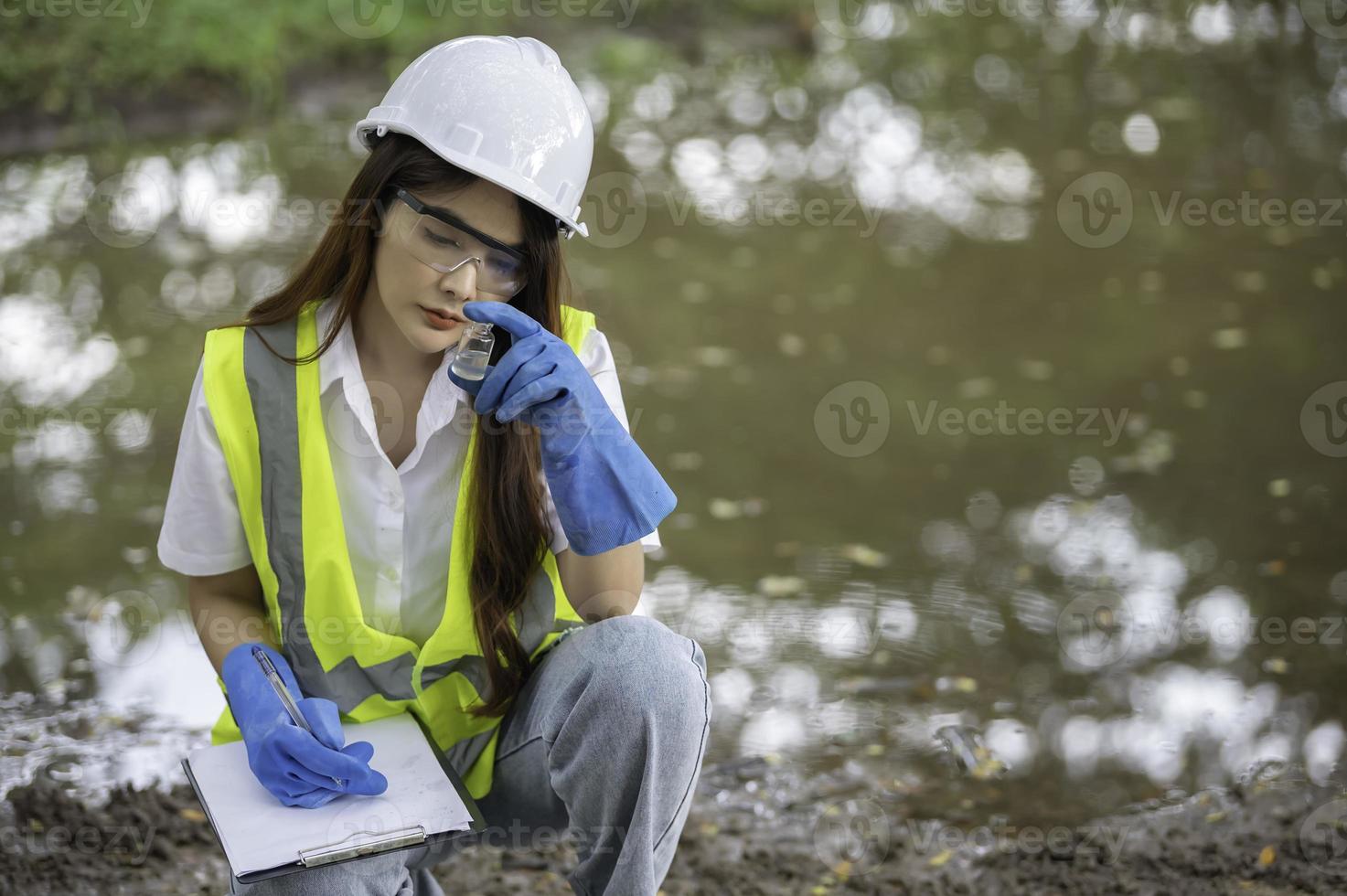 Environmental engineers inspect water quality,Bring water to the lab for testing,Check the mineral content in water and soil,Check for contaminants in water sources. photo