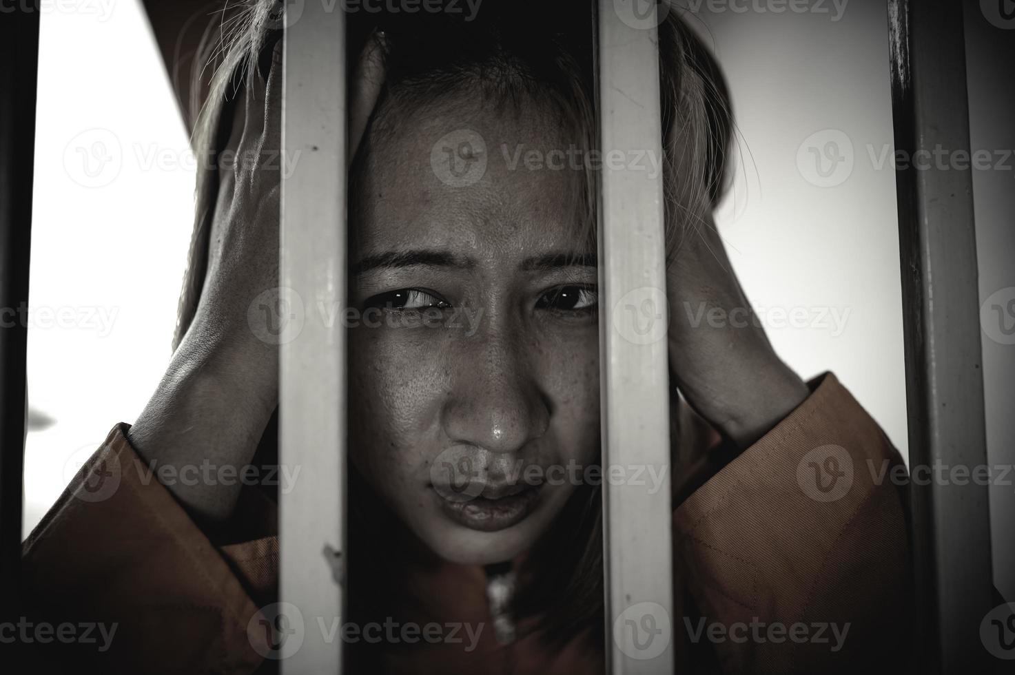 Hands of women desperate to catch the iron prison,prisoner concept,thailand people,Hope to be free,If the violate the law would be arrested and jailed photo