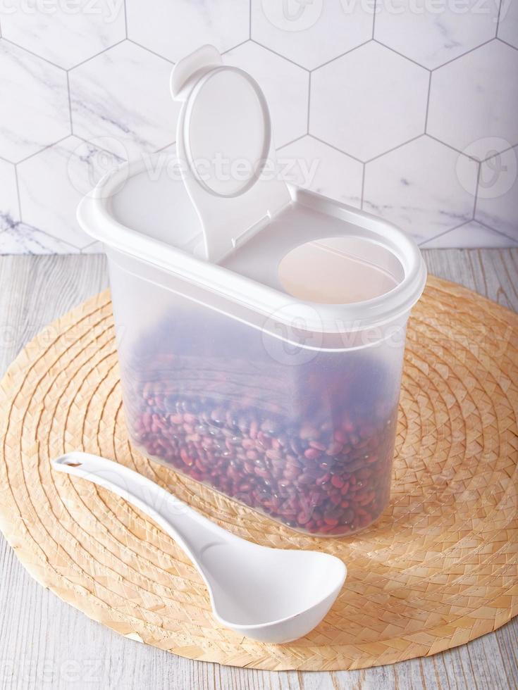 Organization of food storage in the kitchen, transparent reusable jars for cereals, coffee, sugar and pasta photo