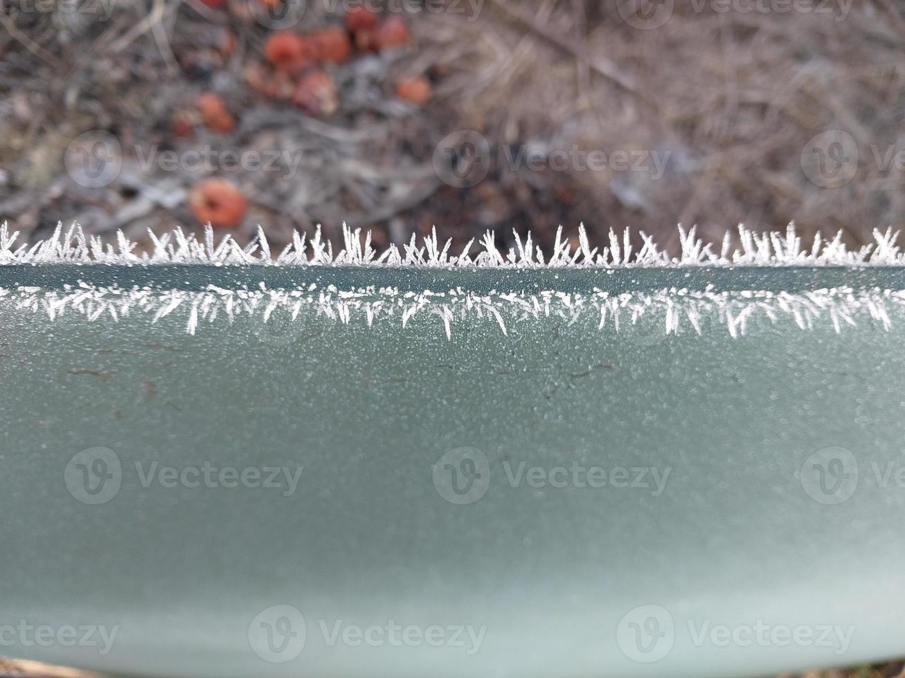 Frost on frozen car glass photo