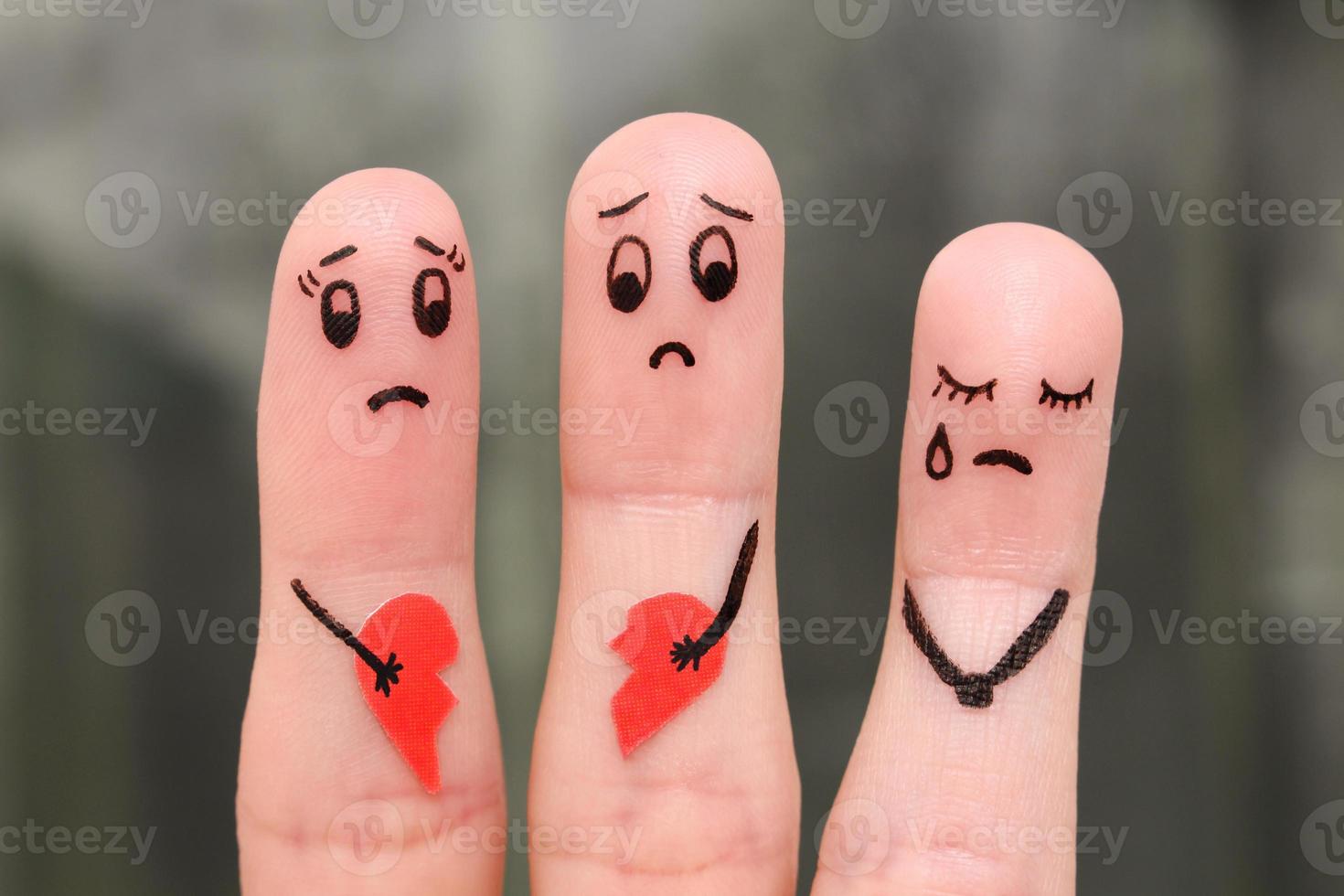 Finger art of family during quarrel. The concept of parents quarrel, child was upset. photo