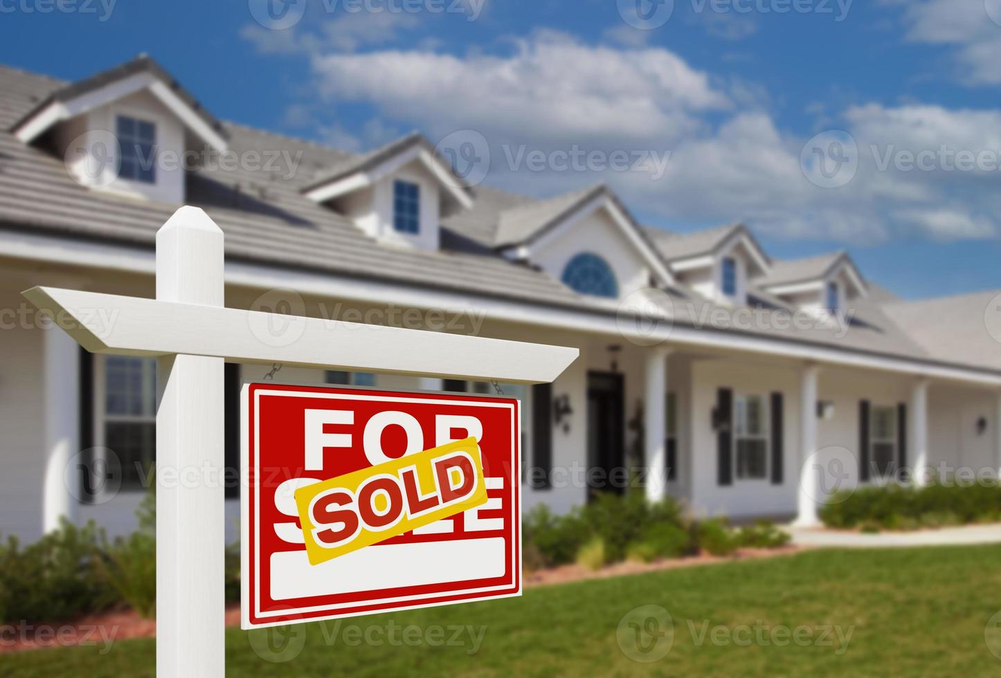 Sold For Sale Real Estate Sign in Front of New House. photo