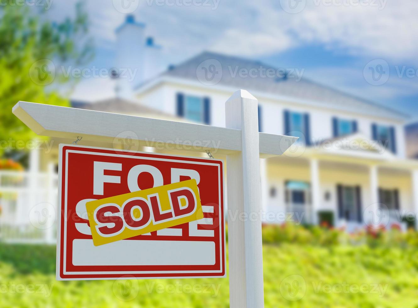 Sold For Sale Real Estate Sign in Front of New House. photo