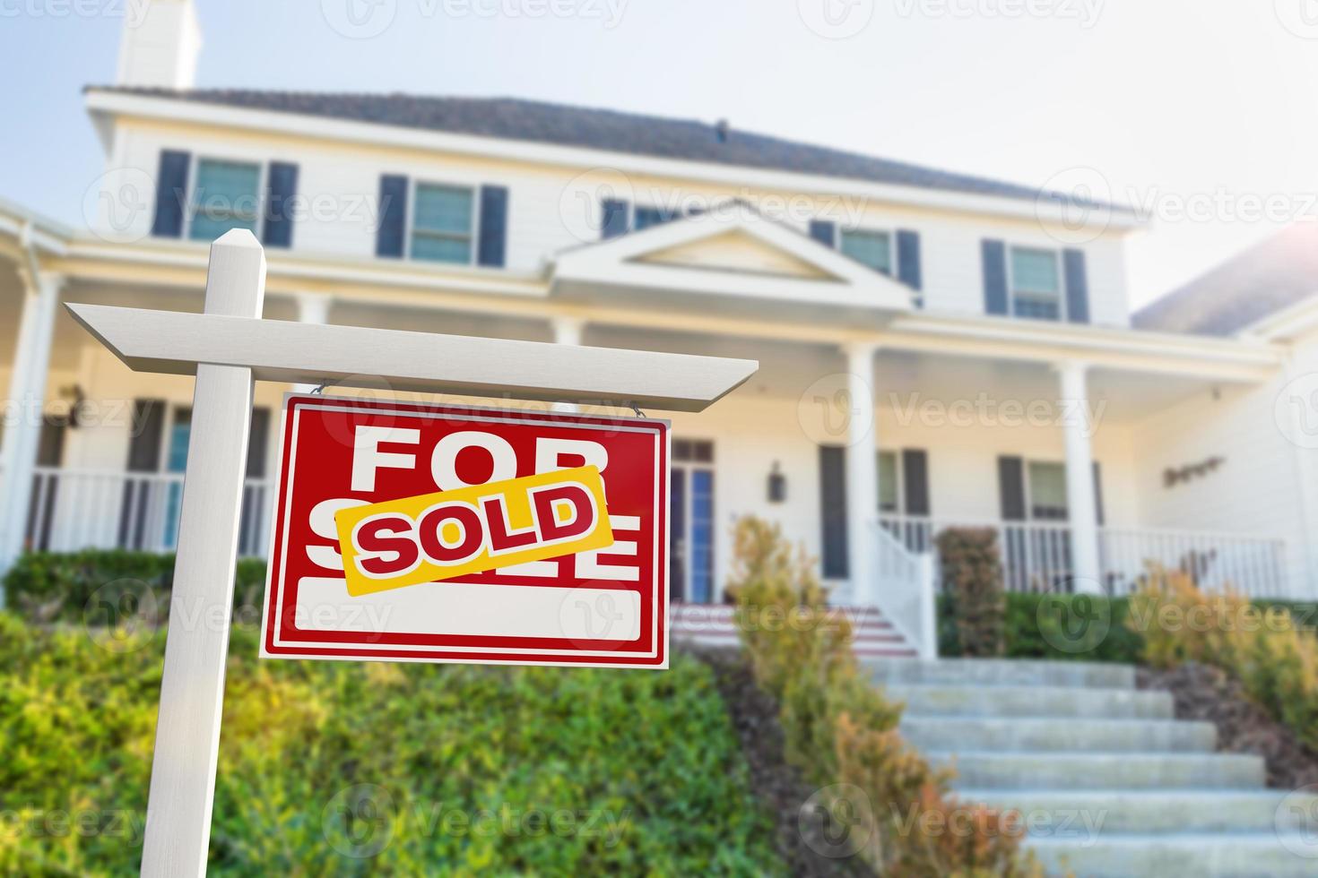 Sold For Sale Real Estate Sign in Front of New House. photo