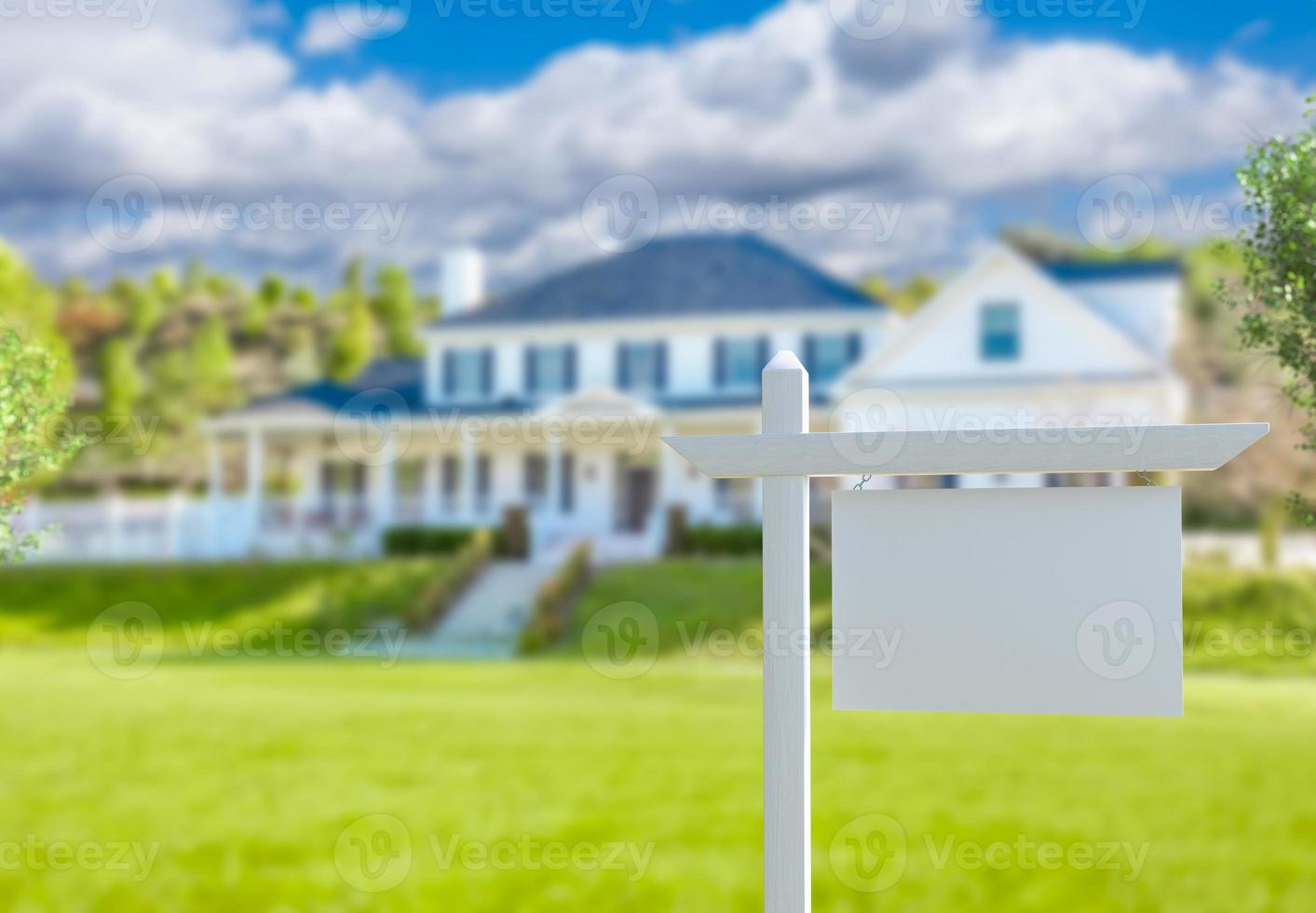 Blank Real Estate Sign in Front of New House. photo