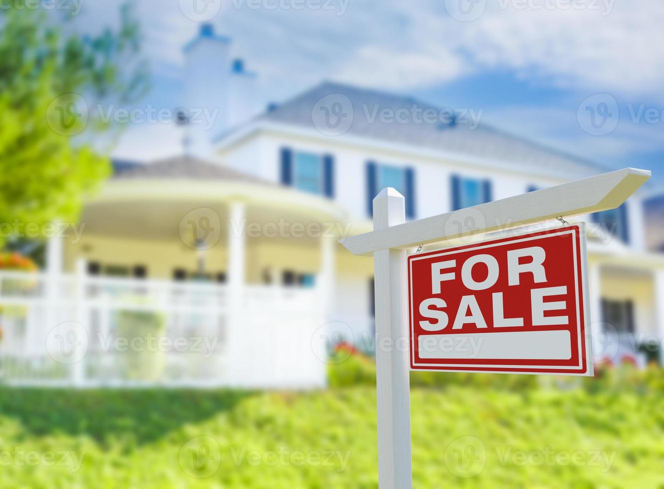 For Sale Real Estate Sign in Front of New House. photo