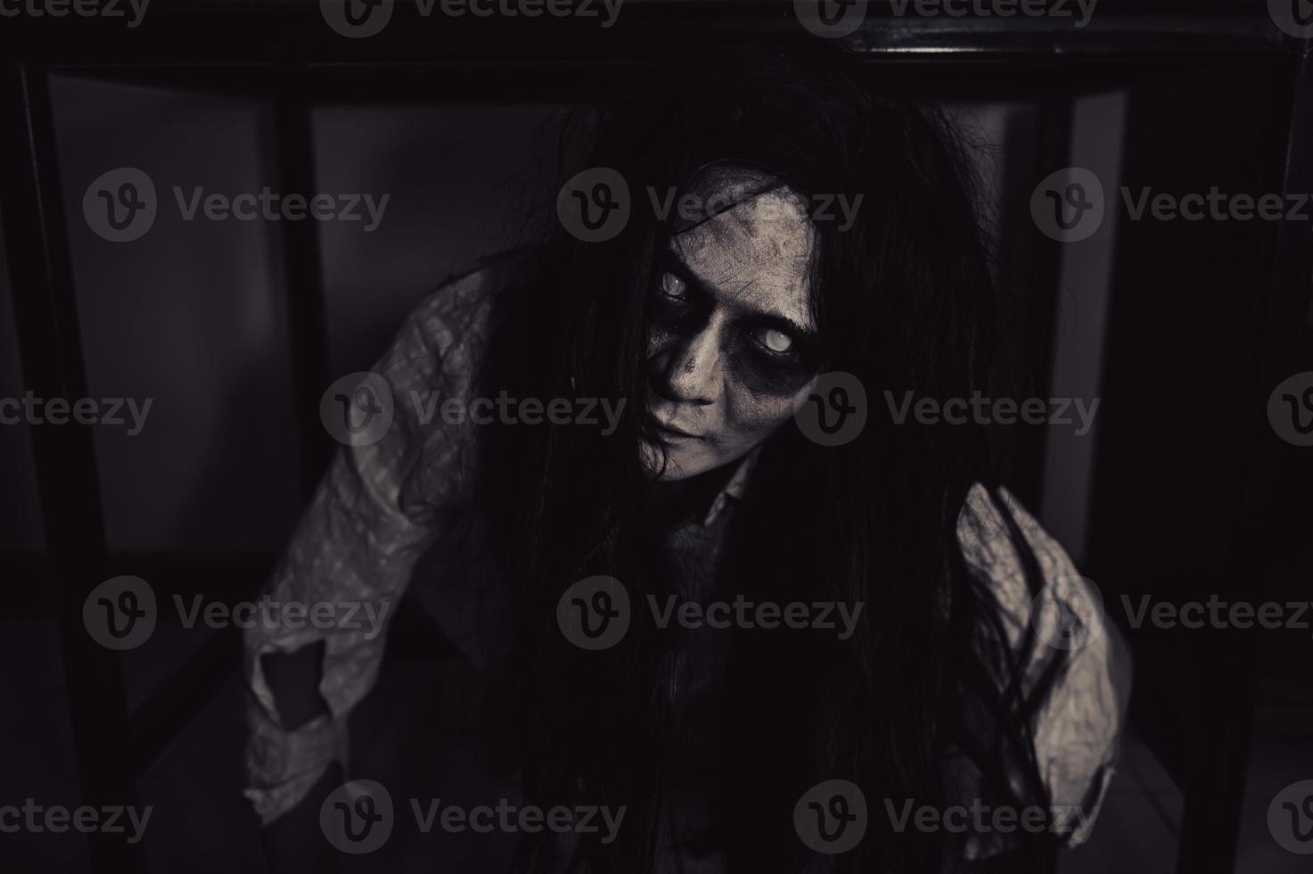 Portrait of asian woman make up ghost,Scary horror scene for background,Halloween festival concept,Ghost movies poster,angry spirit in the apartment photo