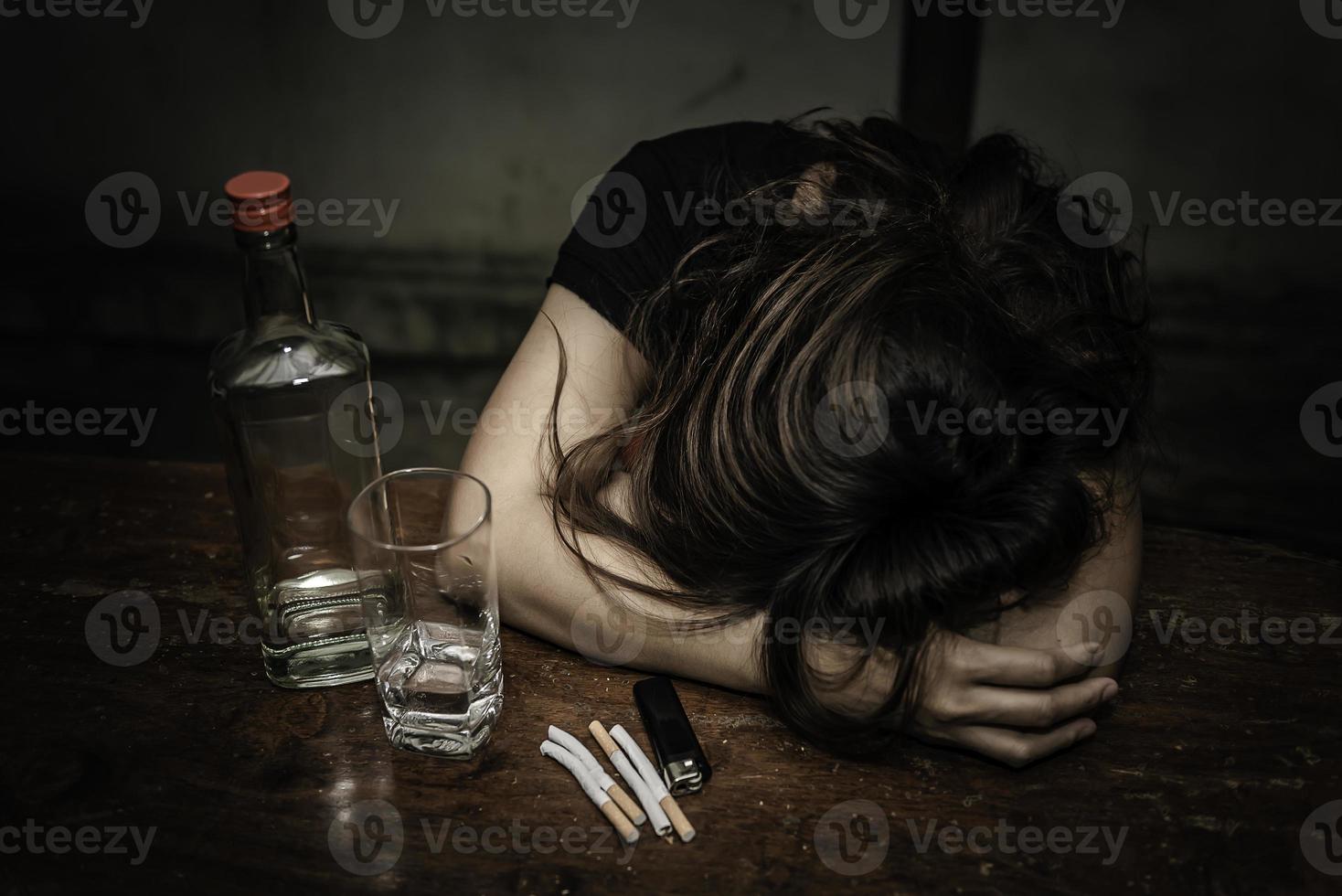 Asian woman drink vodka alone at home on night time,Thailand people,Stress woman drunk concept photo