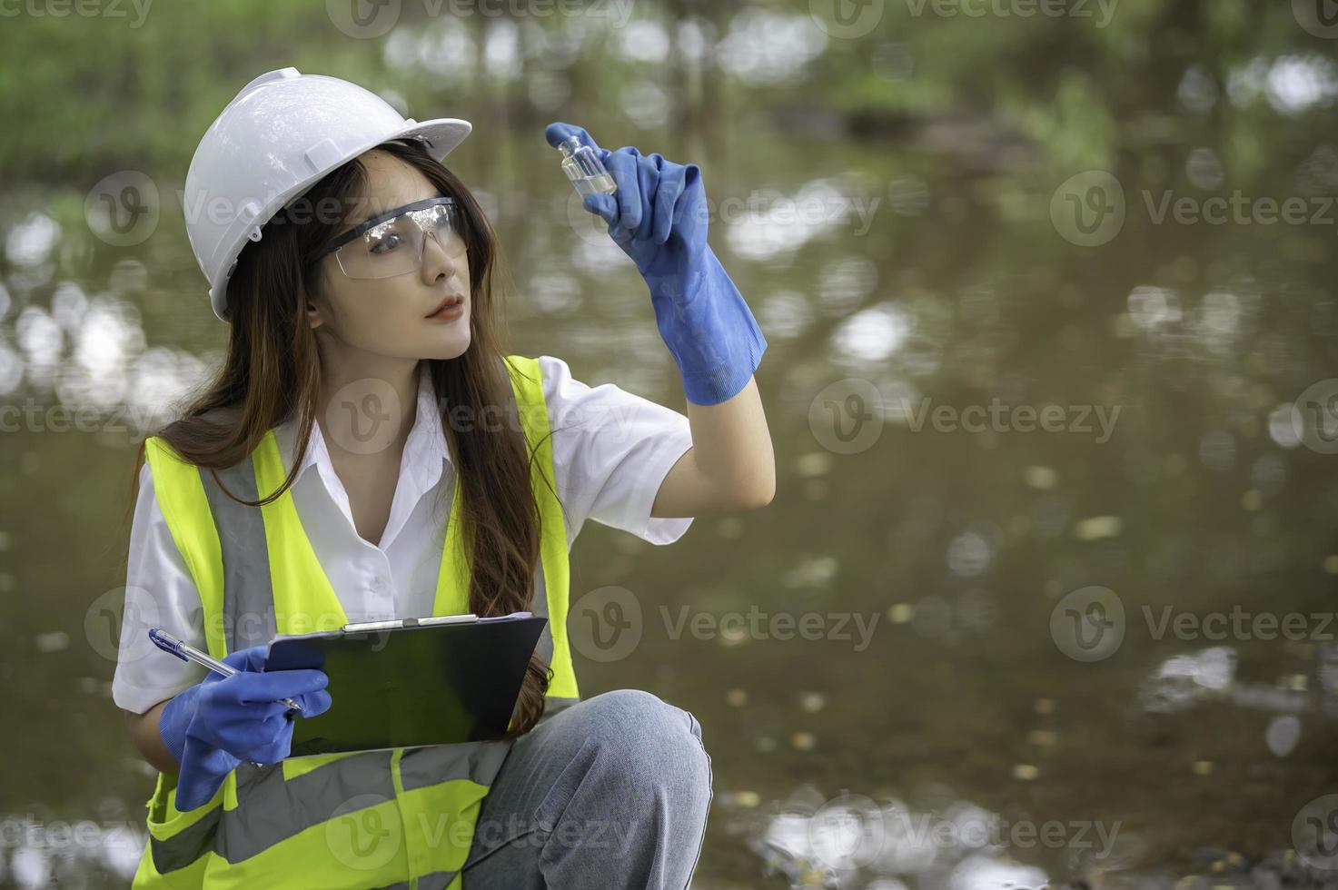 Environmental engineers inspect water quality,Bring water to the lab for testing,Check the mineral content in water and soil,Check for contaminants in water sources. photo