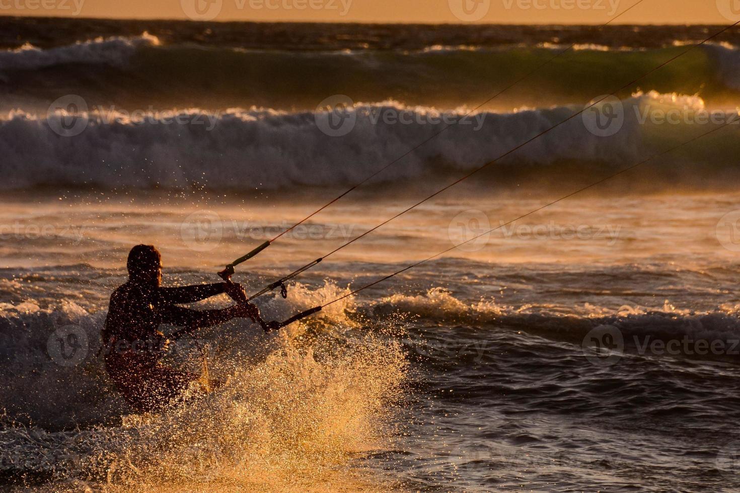 Kitesurfer at sunset photo