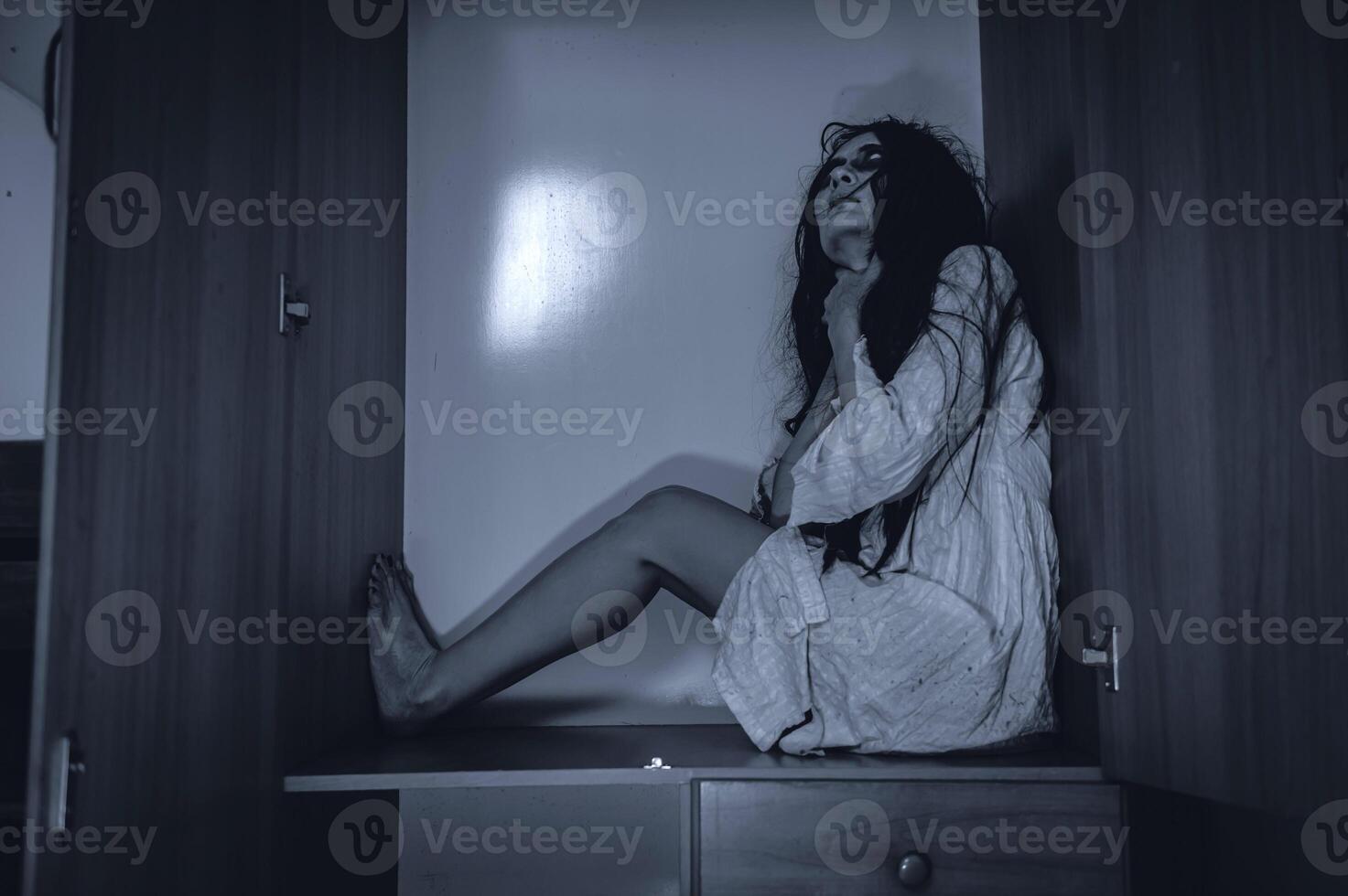 Portrait of asian woman make up ghost,Scary horror scene for background,Halloween festival concept,Ghost movies poster,angry spirit in the apartment photo