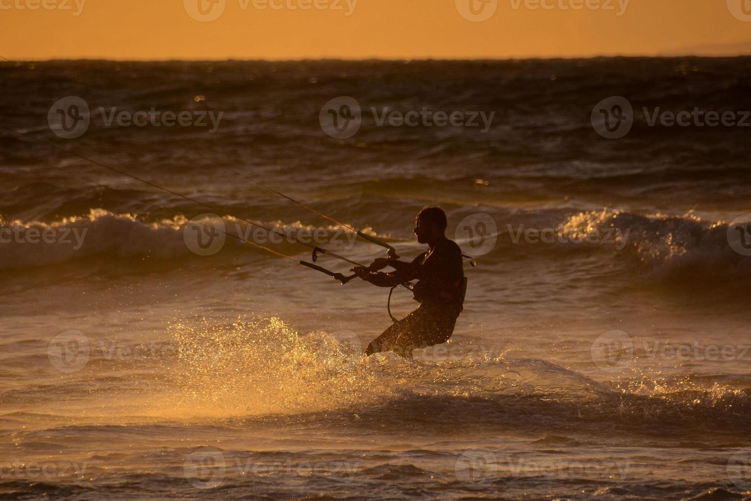 Kitesurfer at sunset photo