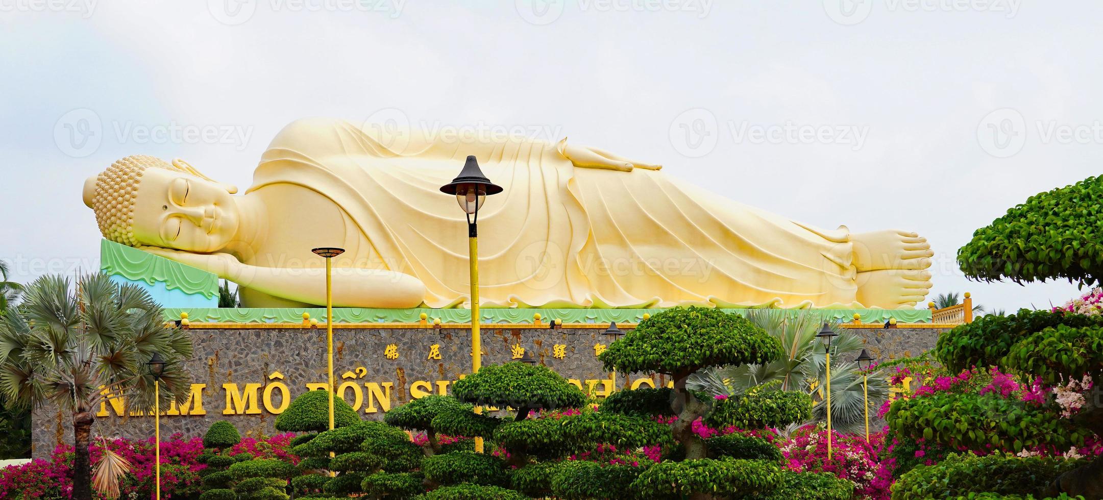 Reclining Buddha statue at a pagoda in the Mekong Delta, Vietnam photo