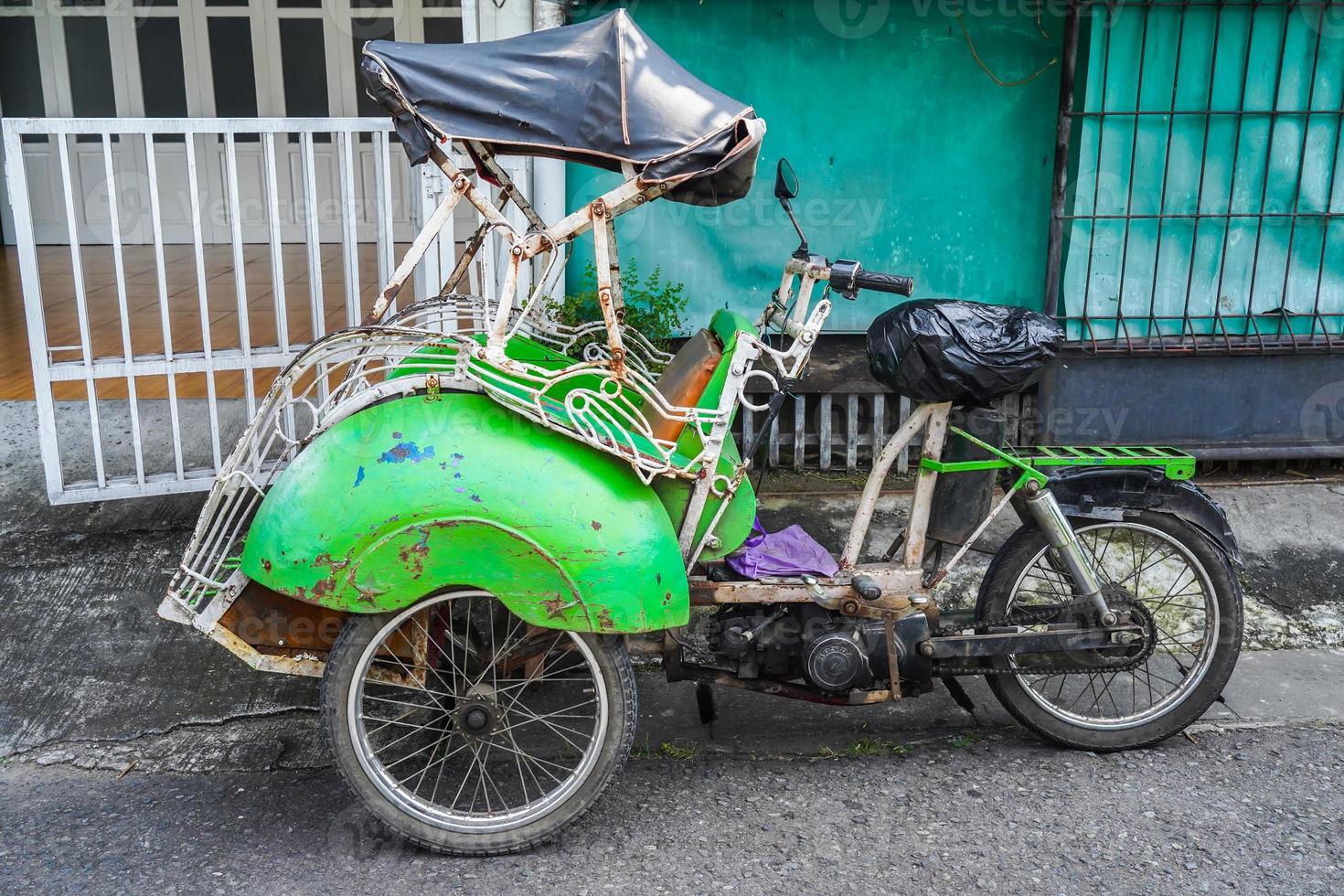 Yogyakarta, Indonesia, May 3, 2022  Bentor is a traditional Indonesian transportation. Bentor means motor rickshaw pedicab with a motorcycle engine photo