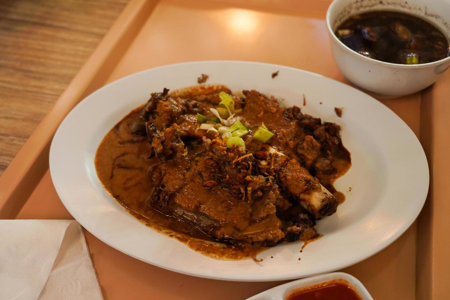 Sop Konro Soup, konro bakar grilled the delicious one, Beef Soup is usually made from ribs or oxtail, a typical Indonesian soto dish originating from Makassar photo